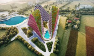 Letecký pohled na rezidenční komplex Qerret Narea Towers s výraznou architekturou, bazénem a jezerem v okolí